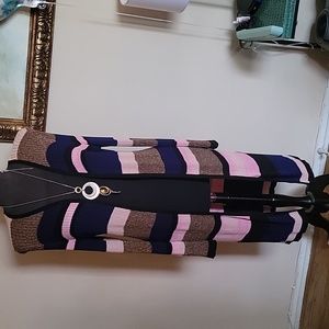 A long sweater, made up of gold,pink, and blue. It's  a 1x by I.N.C